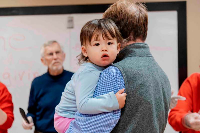 a child holding a man