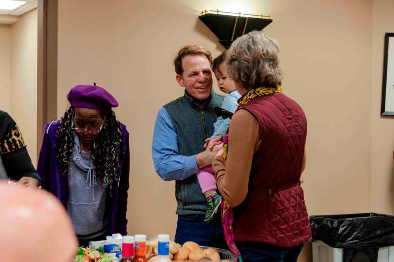 a man holding a baby