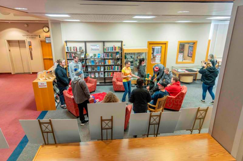 a group of people in a library