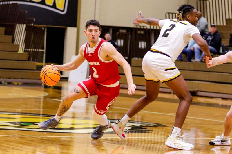 a basketball player dribbling a basketball