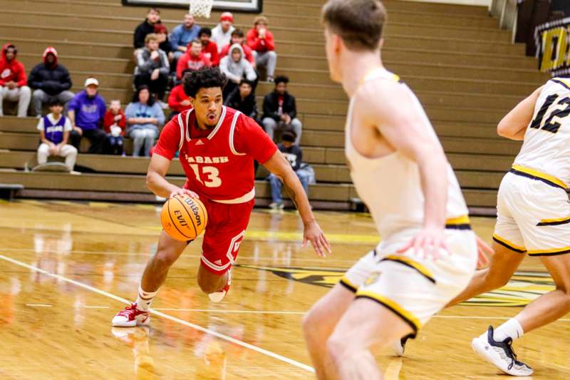 a basketball player dribbling a basketball