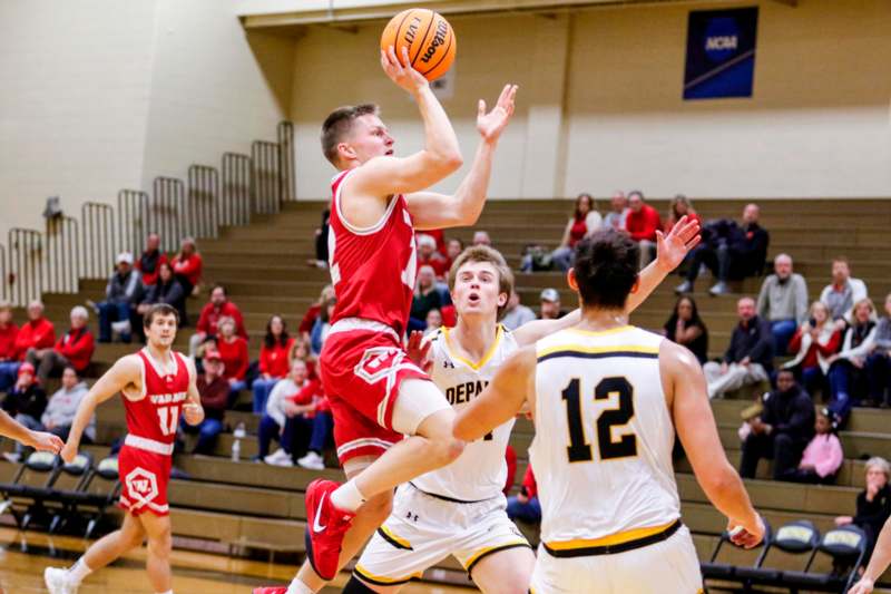 a group of people playing basketball