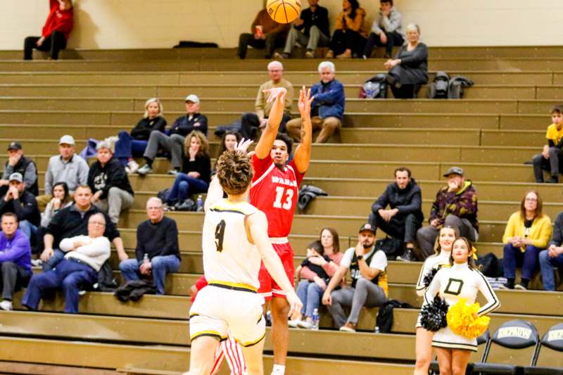 a basketball player shooting a ball