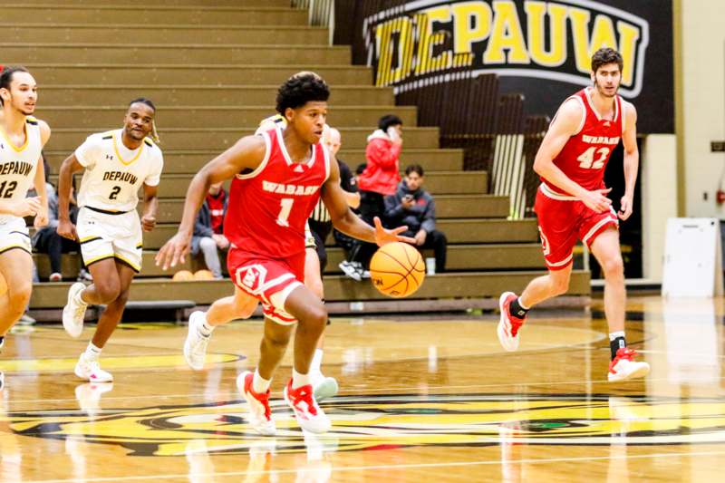 a group of men playing basketball