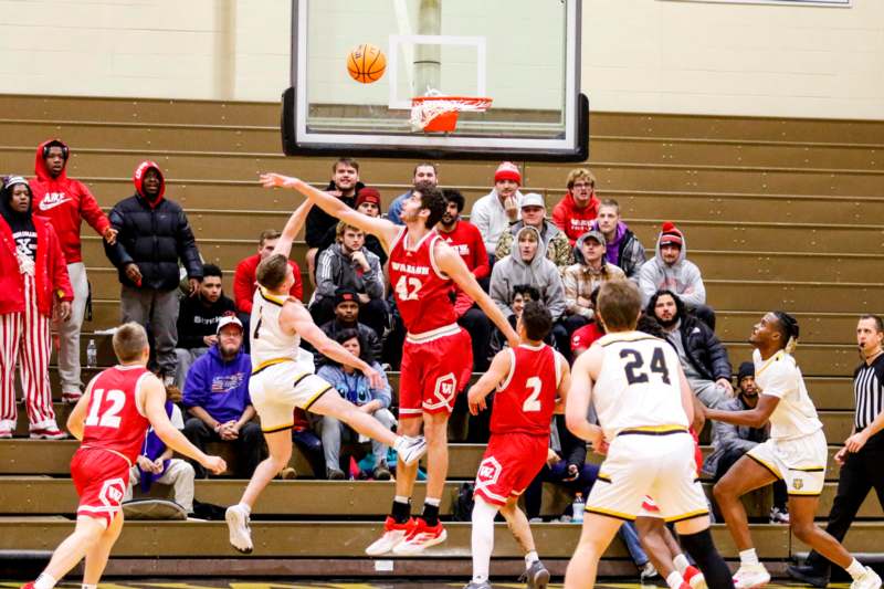 a group of people playing basketball