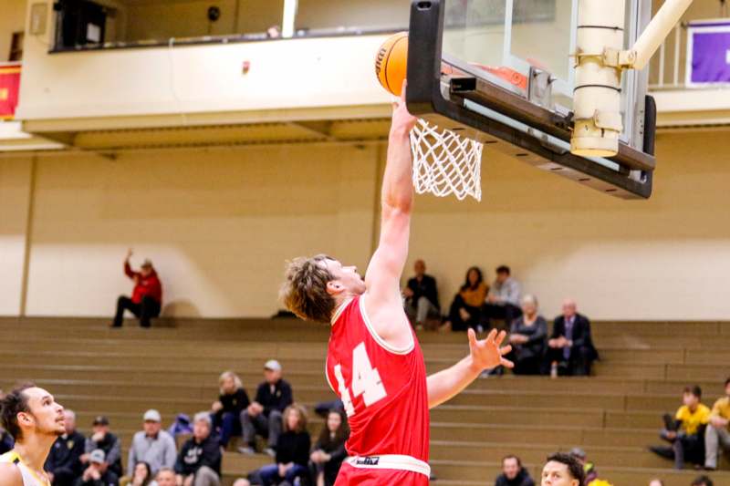 a man dunking a basketball