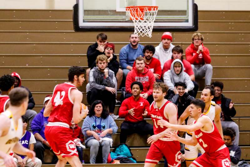 a group of men playing basketball