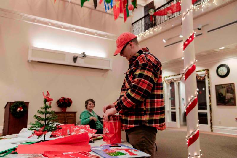 a man opening a bag