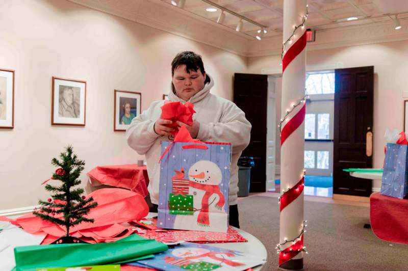 a person holding a gift bag