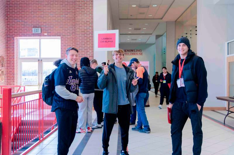 a group of people standing in a building