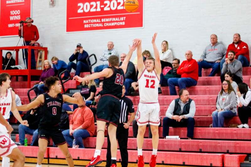 a group of men playing basketball