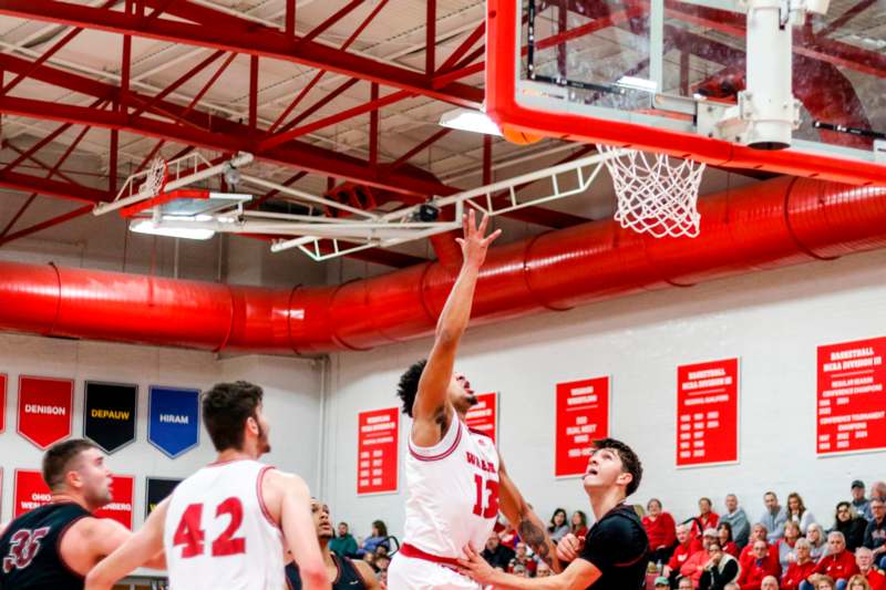 a basketball player dunking a ball