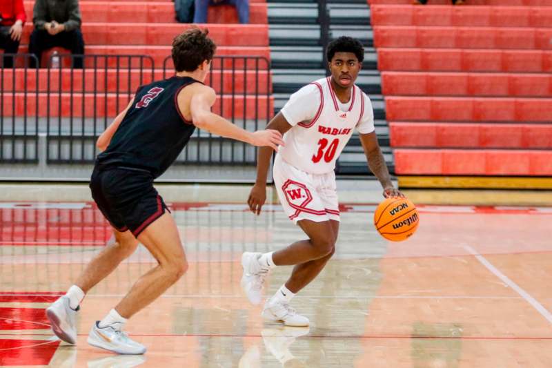 a basketball player dribbling a basketball