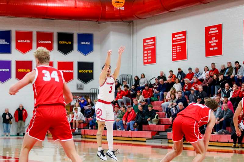 a basketball player jumping to shoot a ball