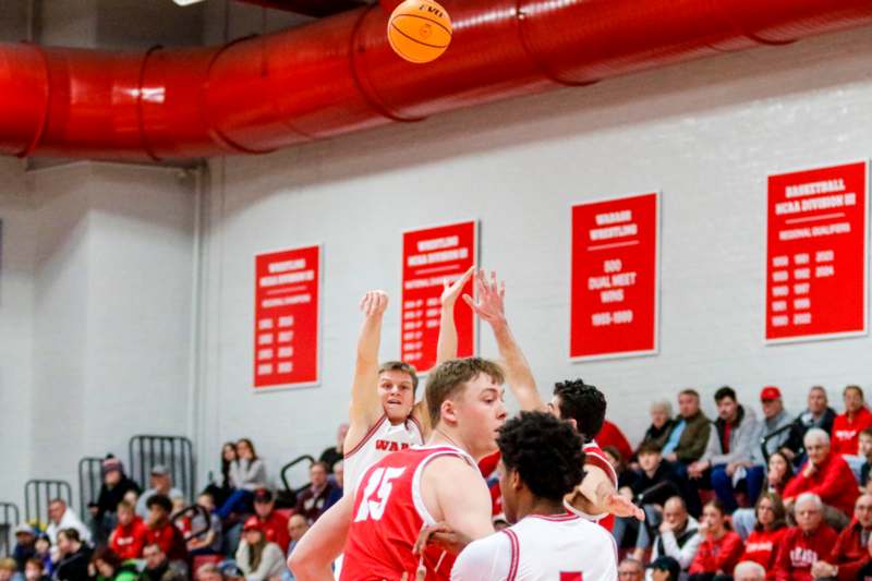 a group of people playing basketball