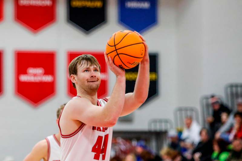 a man holding a basketball