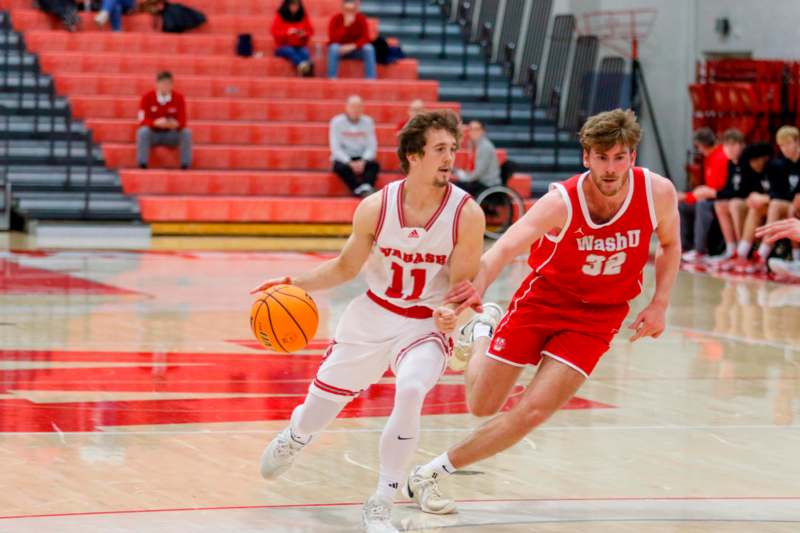 two men playing basketball on a court