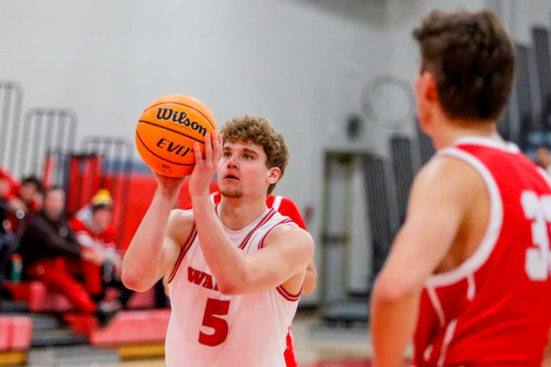 a man in a basketball uniform