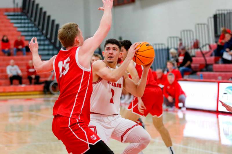 a group of men playing basketball