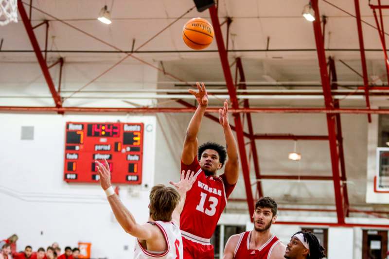 a group of men playing basketball