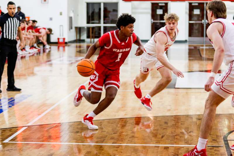 a group of men playing basketball