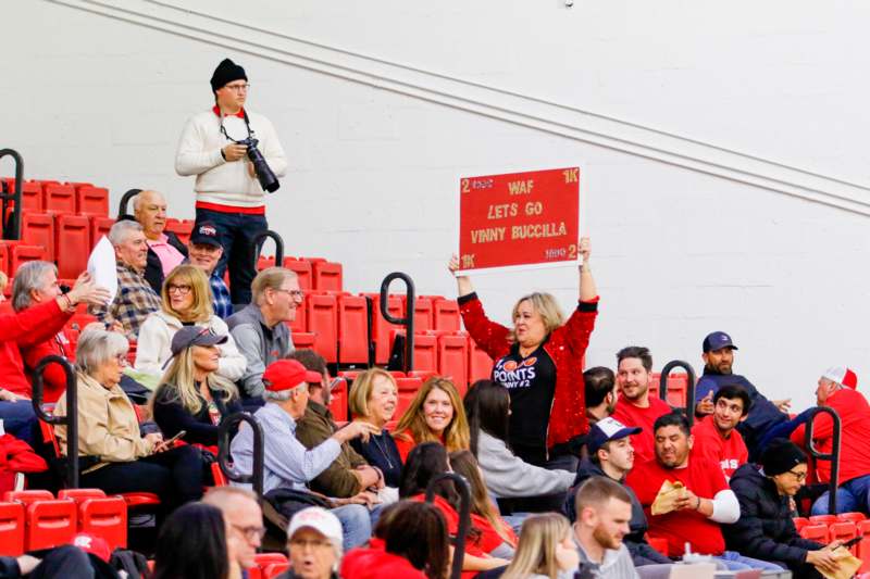 a group of people in bleachers