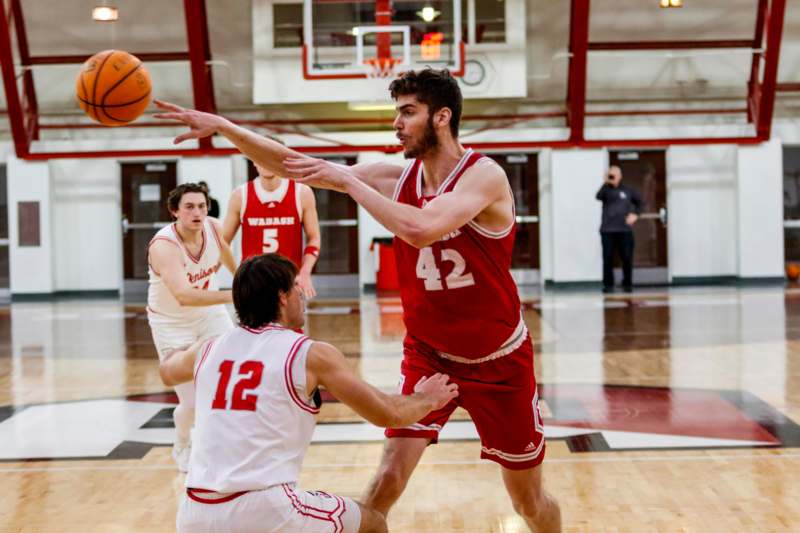 a group of men playing basketball