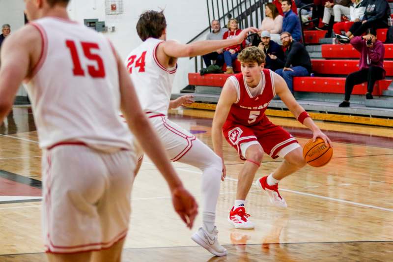 a basketball player dribbling a basketball