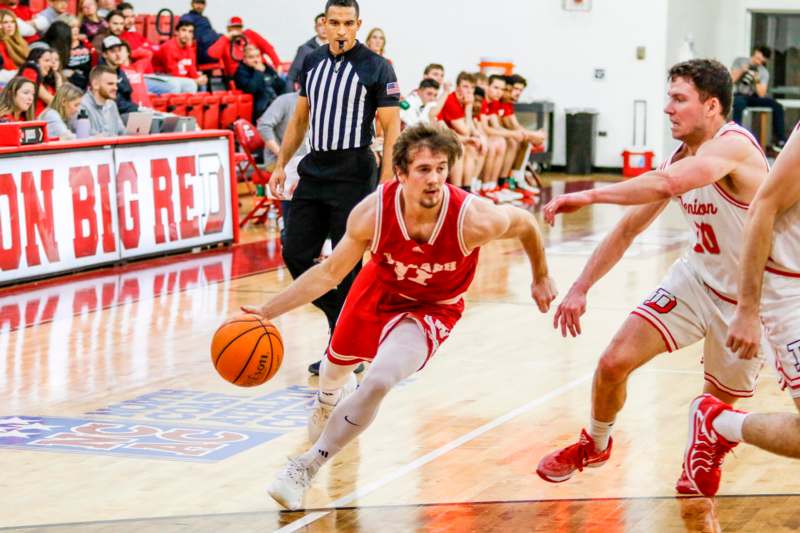 a basketball player dribbling a ball