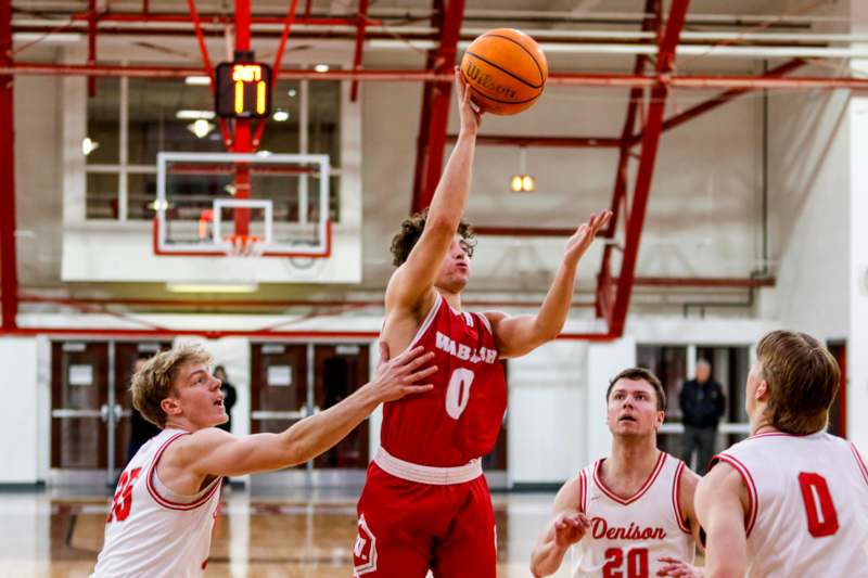 a group of men playing basketball