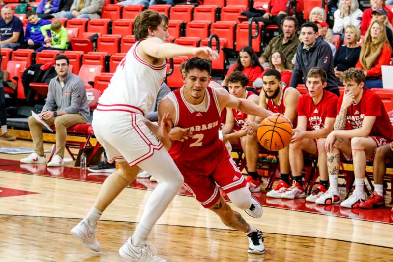 a basketball player dribbling a basketball