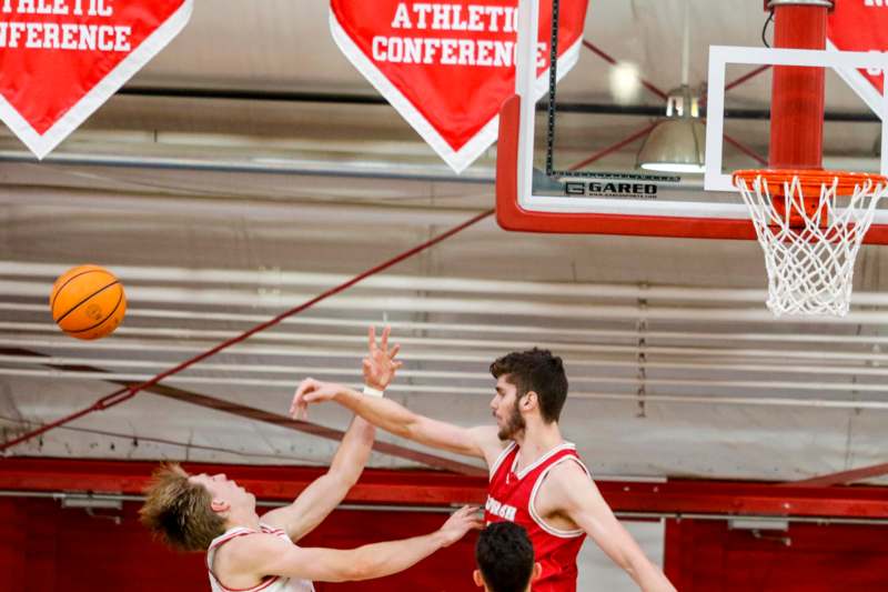 a group of men playing basketball