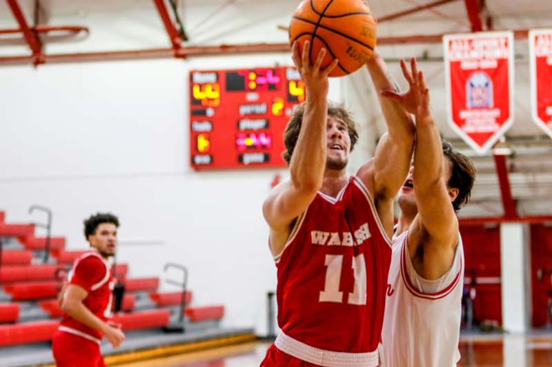 a group of men playing basketball