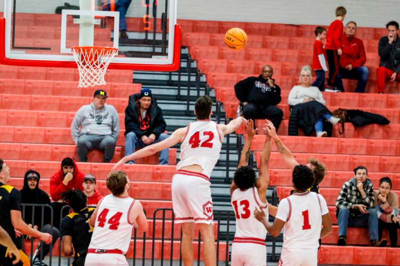 a group of people playing basketball