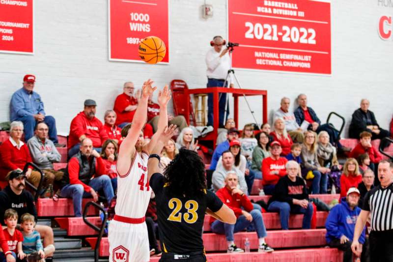 a group of people playing basketball