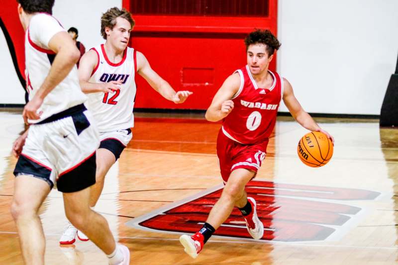 a group of men playing basketball