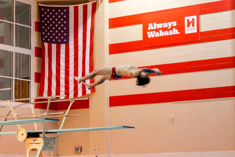 a man diving into a pool