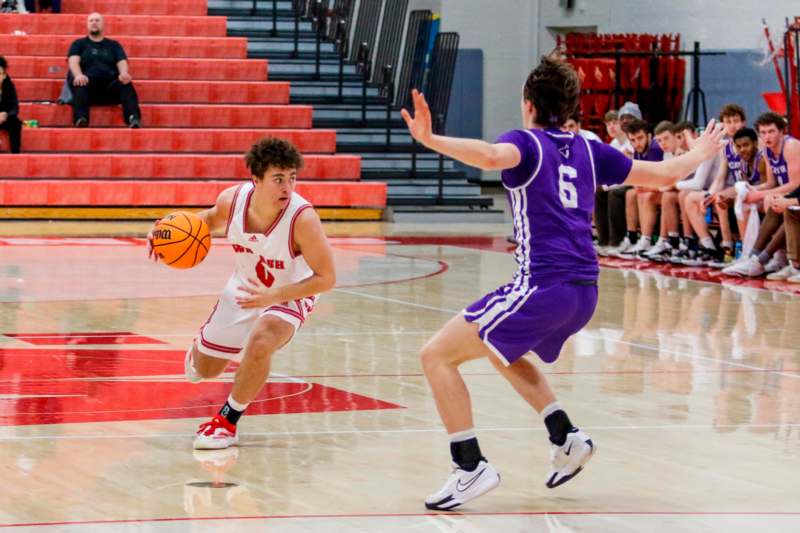 a basketball player dribbling a basketball