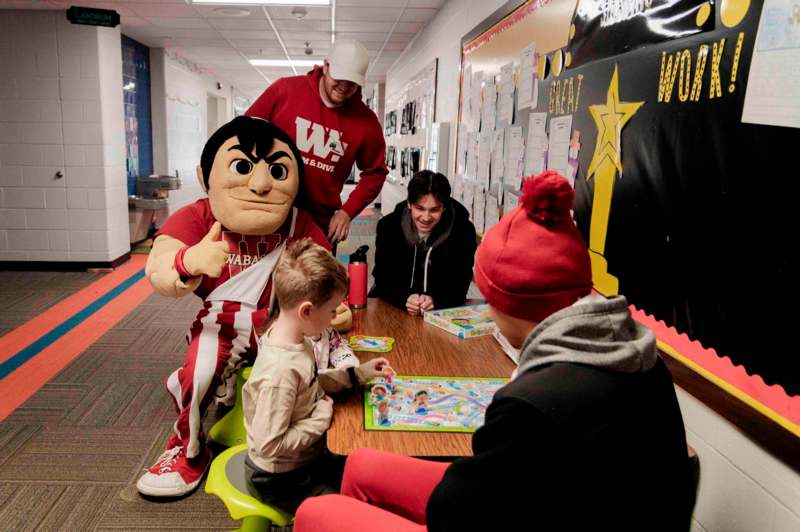 a group of people playing a board game