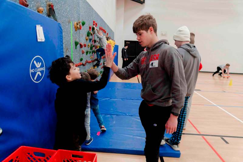 a group of kids giving each other a high five