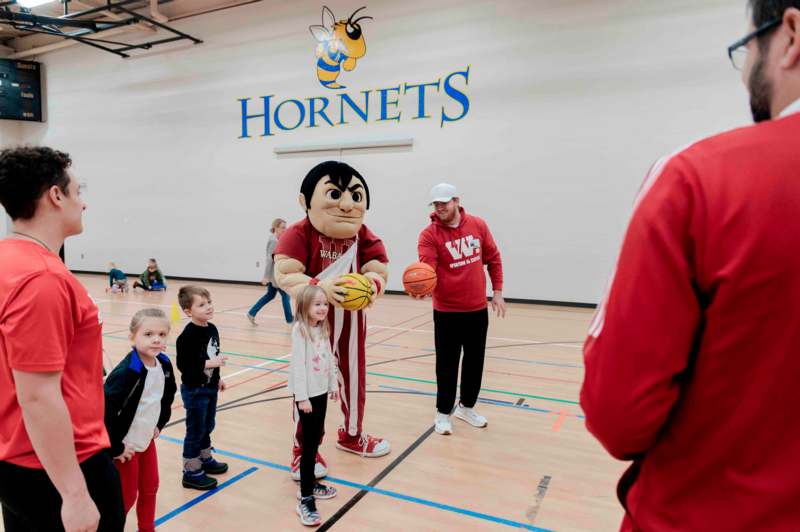 a group of kids in a gym