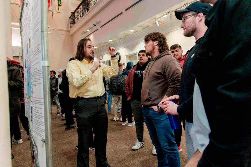 a man speaking to a group of people