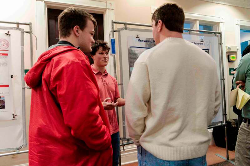 a group of men standing in a room