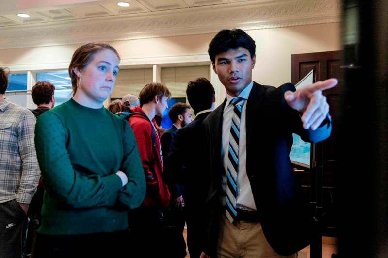 a man and woman pointing at something