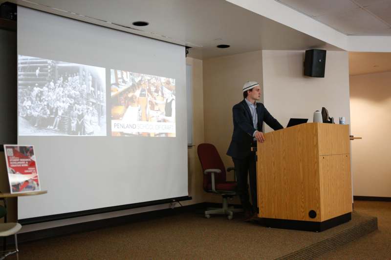 a man standing at a podium