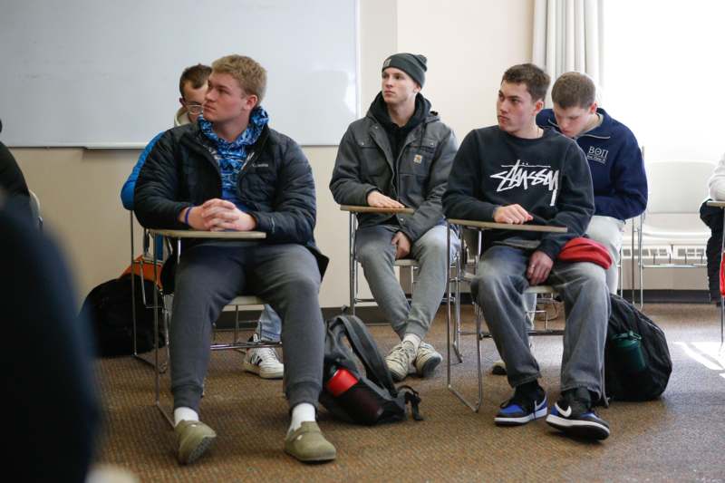 a group of people sitting in chairs