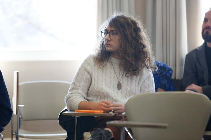 a man sitting in a classroom