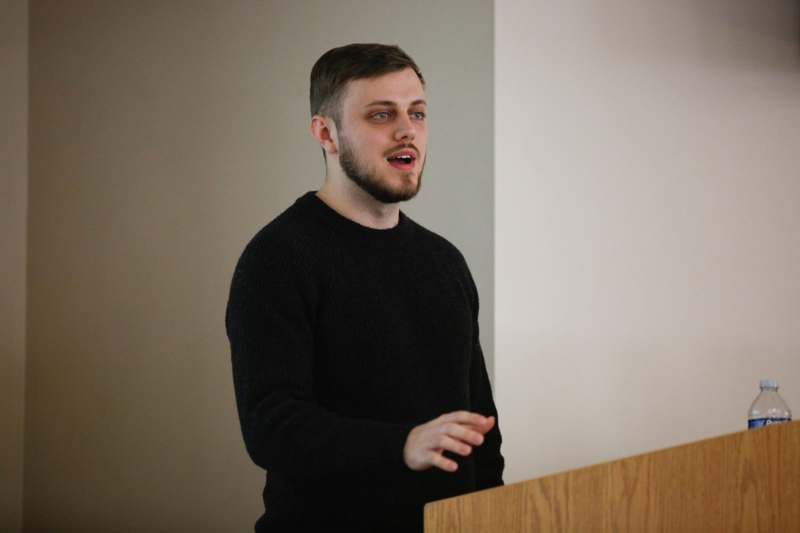 a man standing at a podium