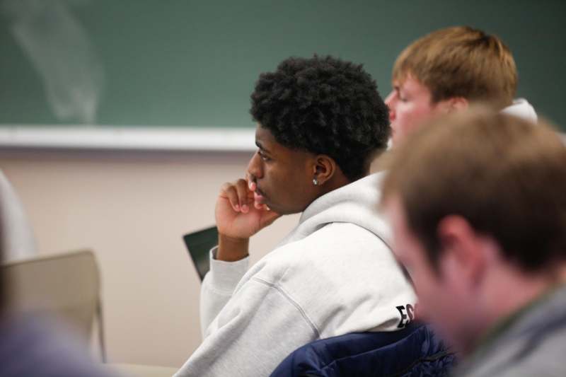 a man sitting in a classroom