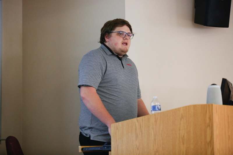 a man standing at a podium